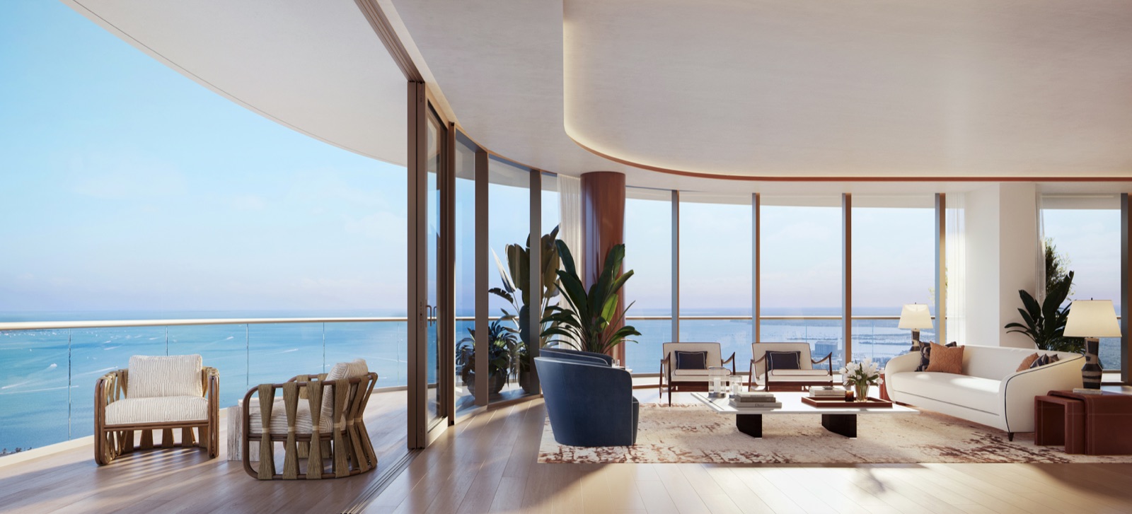 Living room and private terrace with sweeping views of Biscayne Bay and the Brickell skyline.